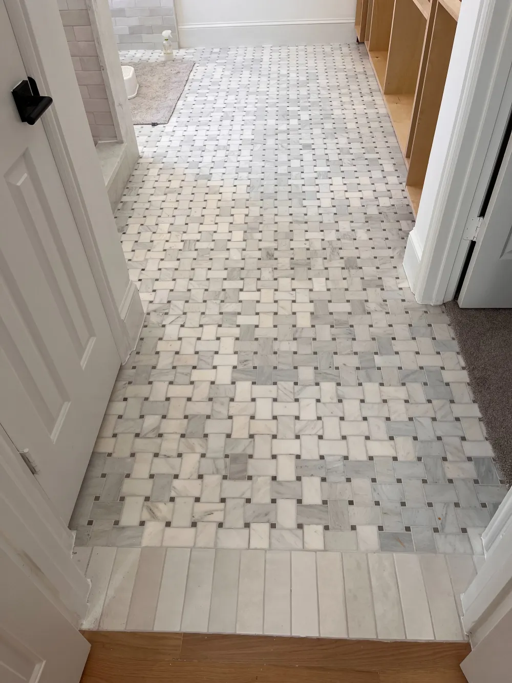 Bathroom remodel featuring a detailed light mosaic tile floor